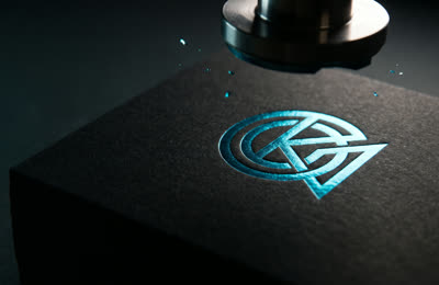 Brand identity design — foil-stamped logo emblem